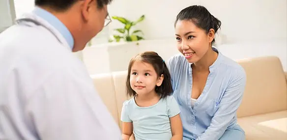 asian male doctor consulting with asian mother and daughter 584x285 1